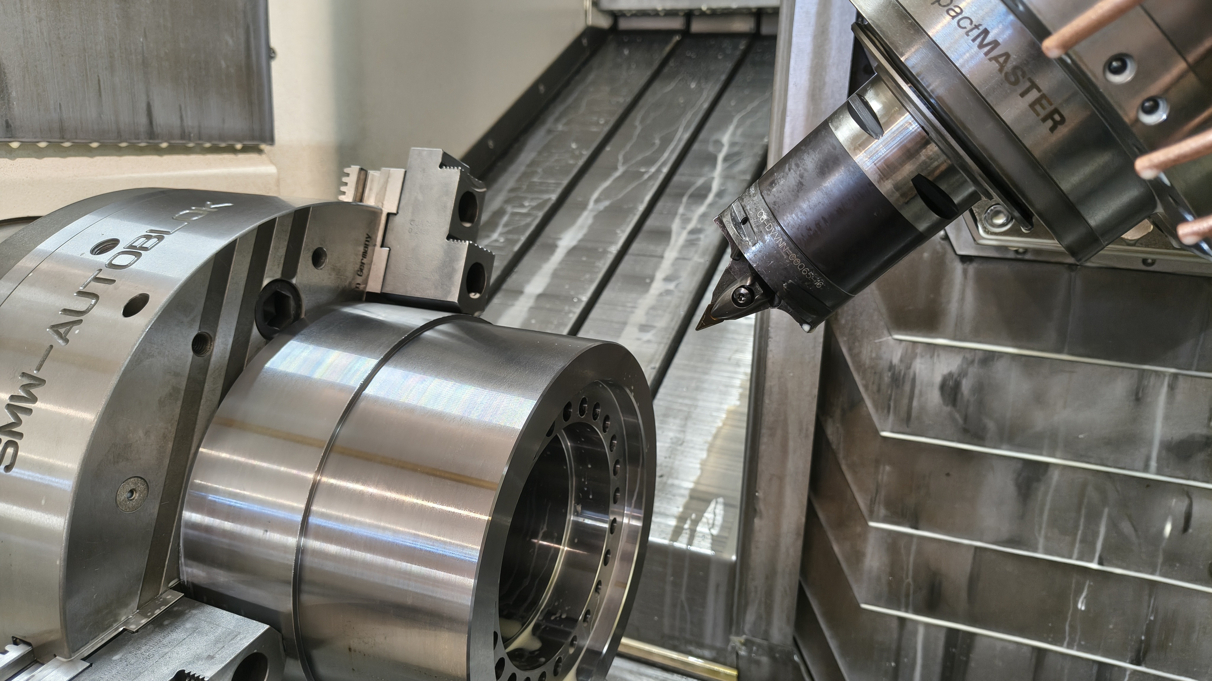 Turning technician setting up multitasking lathe